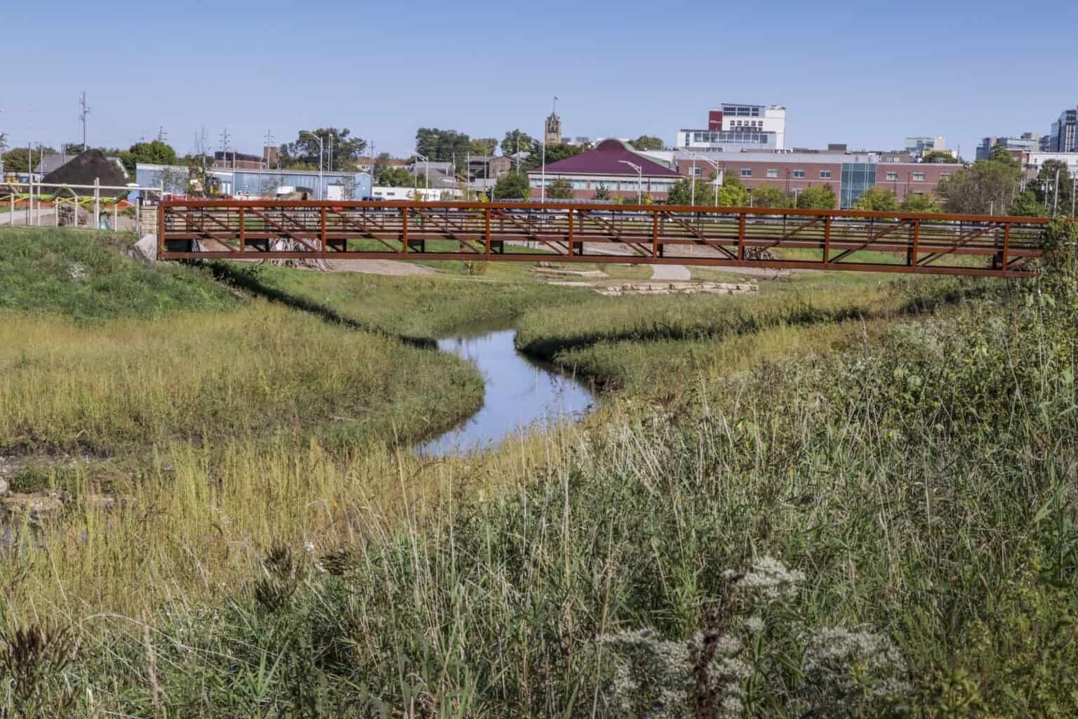 pedestrian bridge over floodplain stormwater creek