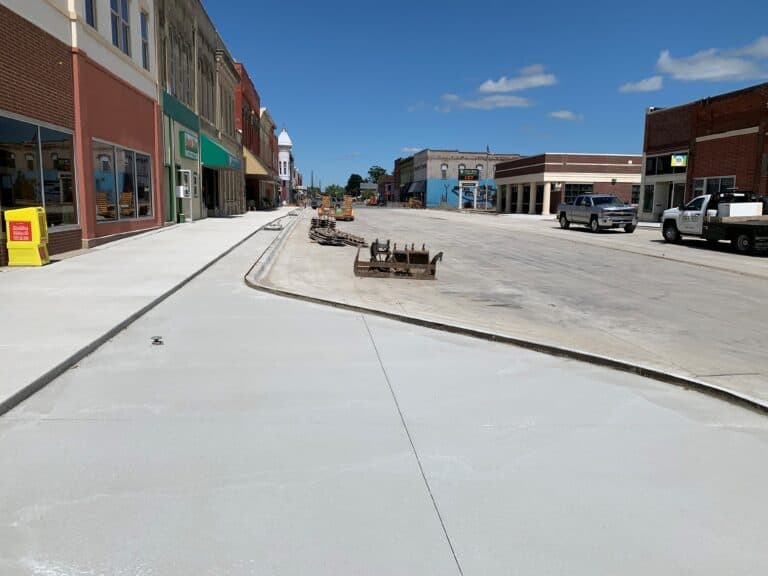 Sidewalk profile to meet building accesses